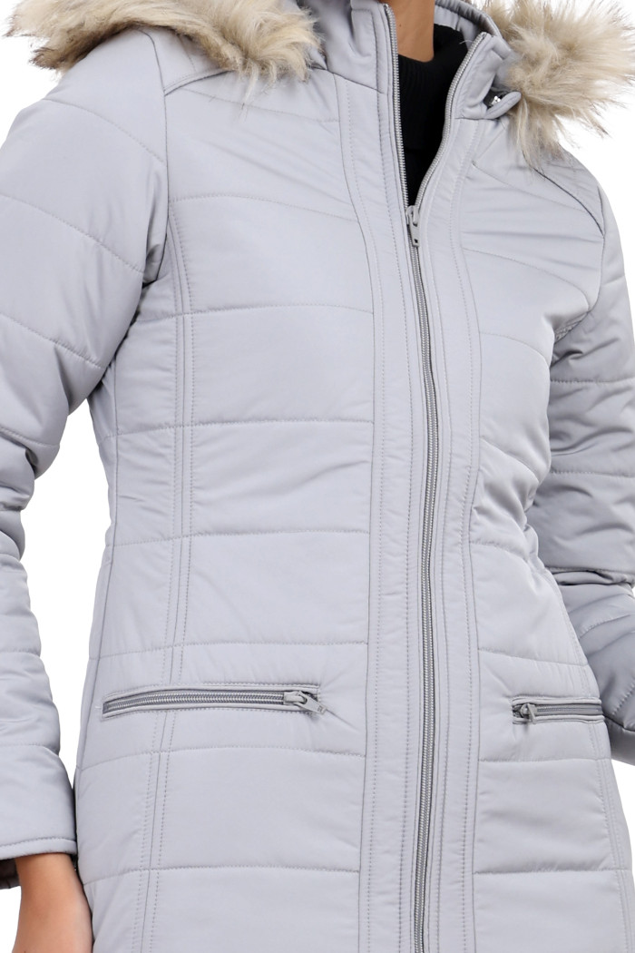 A cropped image of a woman wearing Trufit’s grey Matte Quilted Jacket with Horizontal Pockets, zip closure, and a removable hood.